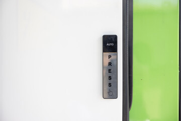 push button on the sliding door of shop. automatic sliding door button.