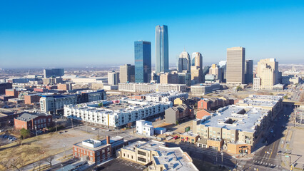 Multistory apartment complex, downtown loft in Oklahoma City buzzing area with office buildings,...