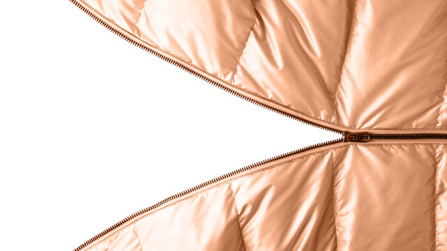 Open dark metal zipper on winter down jacket in trendy color 2024 Peach Fuzz. Detail of trendy metal color jacket with open zipper isolated on white