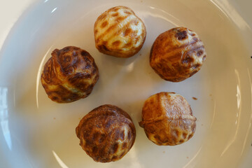 Walnut cakes are a popular snack in Korea. It is a type of pastry bread baked with wheat flour dough and walnuts and red bean paste inside.