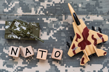 the word 'NATO' laid the sleeves on the khaki background of the Russian