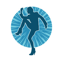 Fototapeta premium Silhouette of a slim female in dance pose. Silhouette of a woman dancing.
