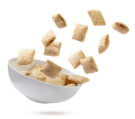 Cereal pillows fly off the plate on a white background. Isolated