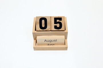 5th of August wooden perpetual calendar. Shot close up isolated on a white background