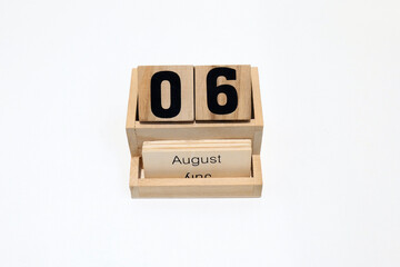6th of August wooden perpetual calendar. Shot close up isolated on a white background