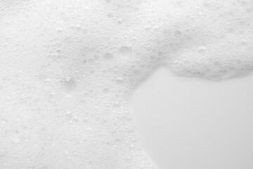 Abstract white soap foam bubbles texture on white background