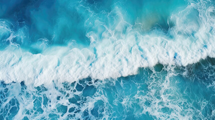 Fototapeta premium Aerial view of blue ocean wave. Top view of turquoise water with foam .