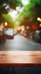 Fototapeta na wymiar Empty wood table top on blur of traffic jam with bokeh light background