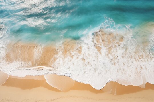 The image shows a large turquoise wave crashing onto a sandy beach