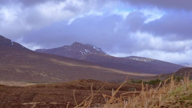 View of beautiful countryside in the Scottish highland with mountains, trees and sea