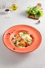 Gourmet Caesar Salad with Succulent Shrimp and Quail Eggs on a Terracotta Plate