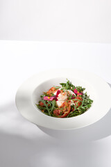 Italian salad with burrata, tomatoes, and arugula in shadow, garnished with edible flowers
