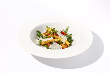 Artichoke and tomato salad with shaved Parmesan cheese