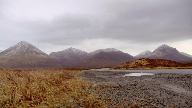 View of beautiful countryside in the Scottish highland with mountains, trees and sea