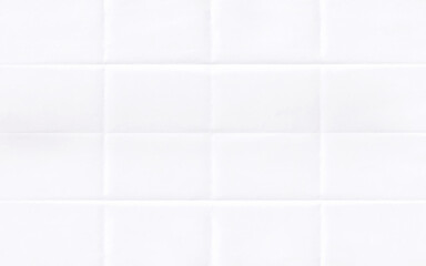 White folded crumpled paper background.