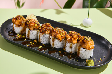 Salmon Tartare Sushi Roll Adorned with Unagi Sauce and Pistachio. Suitable for upscale dining and flavor fusion concepts
