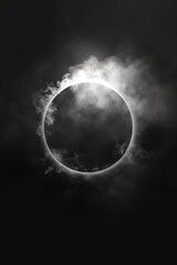 Naklejka na ściany i meble A captivating black and white photo capturing a ring of smoke. Perfect for adding a touch of intrigue to any project