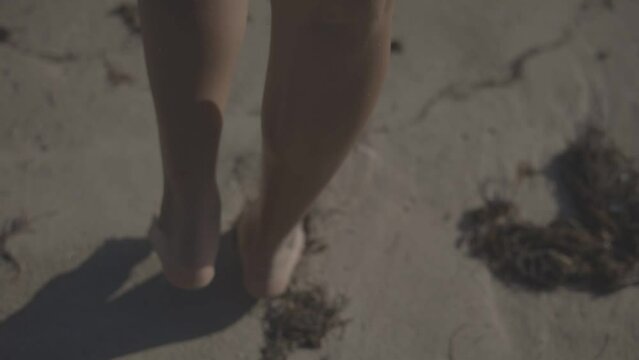 girl walks on the sand of the beach juan dolio towards the sea, slow motion HD