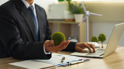 Windmill green energy Business people working in green eco friendly office business meeting creative ideas for business eco friendly professional teaching corporate people sustainable electrici