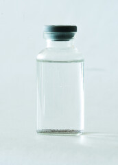 tiny transparent vaccine vial isolated