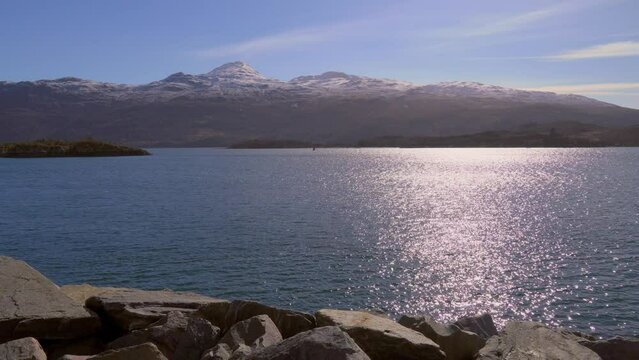 View of beautiful countryside in the Scottish highland with mountains, trees and sea