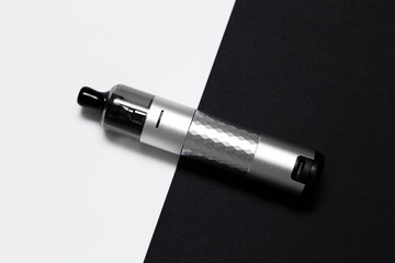 Vaping device, vape, pod, kit silver color on black and white background, top view