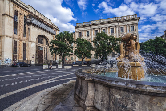 Catania, Italy - December 16, 2016: Palazzo delle Finanze and Casa del Mutilato buildings (left) on Square of Vincenzo Bellini in Catania city, Sicily