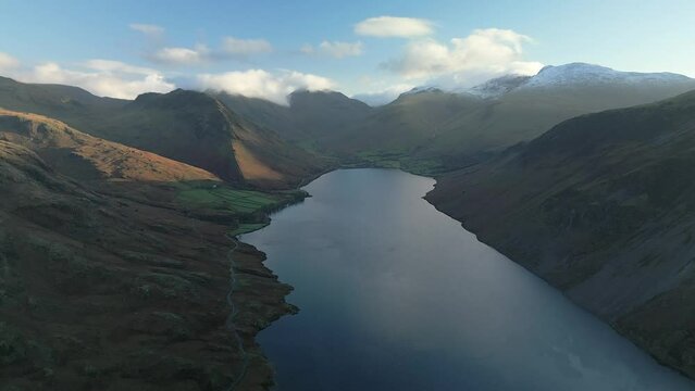 Aerial footage over Wast Water looking towards Wasdale Head and Scafell Pike in the Lake District, Cumbria, United Kingdom