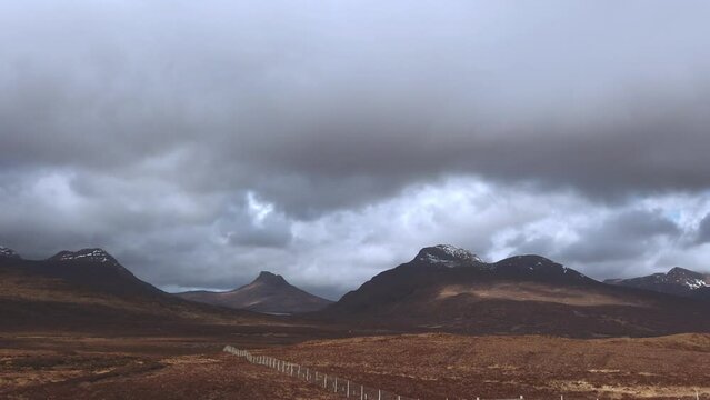 View of beautiful countryside in the Scottish highland with mountains, trees and sea