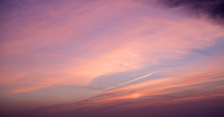 Pink blue sky background with clouds at sunset on a summer evening
