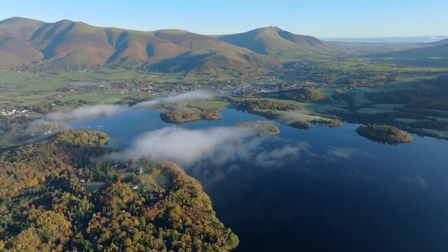 Aerial footage of Derwentwater and the Skiddaw mountain range, Keswick, Lake District National Park, Cumbria, England, United Kingdom