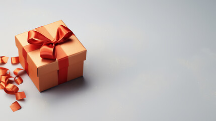 Fototapeta premium gift box in the form of a cubic orange box with a light orange ribbon on a light gray background