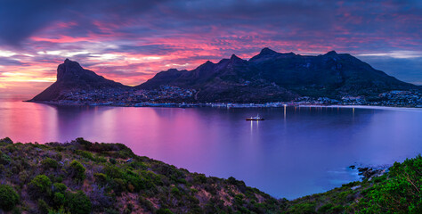 Panorama shot of Hout Bay and fishermans village at dusk with a colorful sky, Cape Town, South...