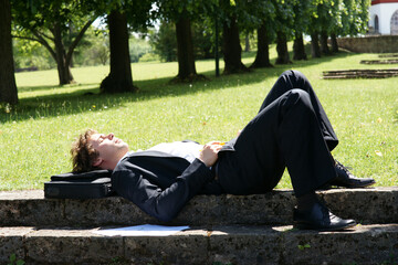 Businessman relaxing in the park during his lunch break