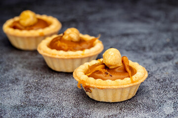Mini tart. Fresh tartlets with caramel hazelnuts.