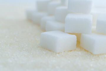 Sugar cubes on top of granulated sugar