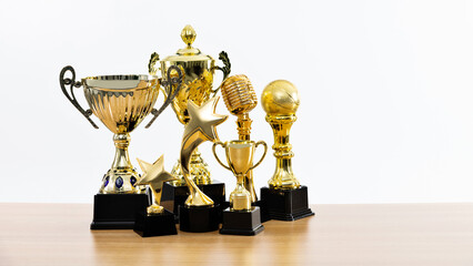 Group of trophies on wooden table