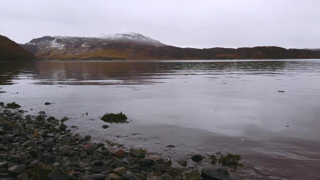 View of beautiful countryside in the Scottish highland with mountains, trees and sea