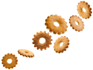 Cookies shaped like a flower sprinkled with sugar fly in the air forming a chain shape. Volumetric...