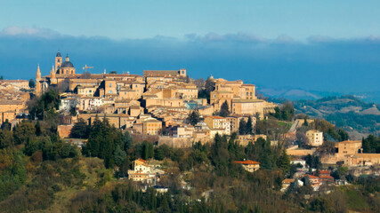 Fototapeta na wymiar Aerial view of Urbino, the capital of the province of Pesaro and Urbino in the Marche, Italy. It was an important city in the Italian Renaissance and its historic center is a world heritage site.