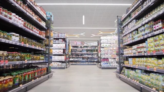 Rows of crowded foodstuffs in a supermarket