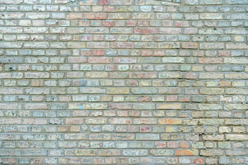 Fototapeta premium Old grunge textured background of chalked empty large brick wall with copy space and mock up, front view