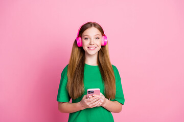 Portrait of teenage girl blonde hair meloman listen wireless earphones spotify trend music with...