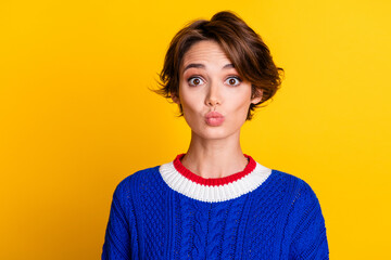 Photo portrait of attractive young woman look camera pouted lips wear trendy blue knitwear clothes isolated on yellow color background - obrazy, fototapety, plakaty