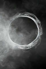 Fototapeta premium A black and white photo capturing the beauty of a smoke ring. This image can be used to add a touch of elegance and mystery to various projects