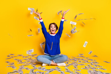 Full length photo of cheerful funky lady dressed knitted sweater rising hands throwing dollars...