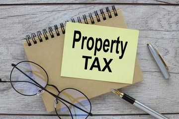 note paper with text. text Property tax symbol. Business and property tax concept. Copy space.