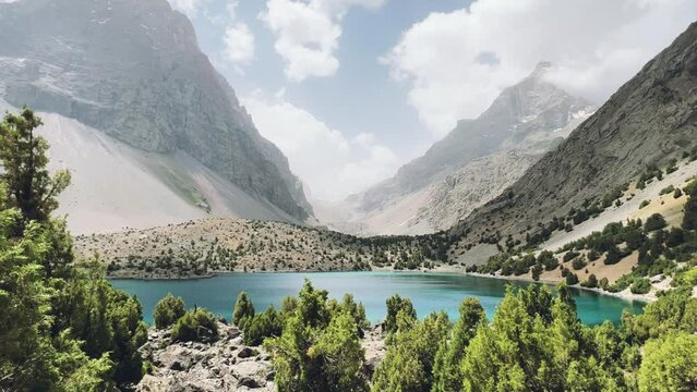 The Alaudin (Chapdara) lakes, lying at an altitude of 2800 m, are considered one of the most beautiful lakes of the Fan Mountains. Turquoise mountain lake. Pamiro-Alai. Tajikistan, Pamir 4K