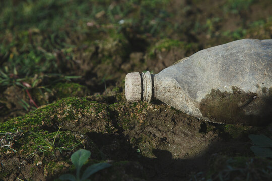 Old used plastic waste bottle, nature pollution concept, global ecology problem