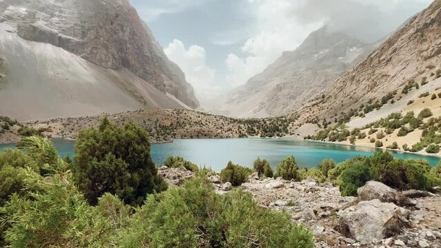 The Alaudin (Chapdara) lakes, lying at an altitude of 2800 m, are considered one of the most beautiful lakes of the Fan Mountains. Turquoise mountain lake. Pamiro-Alai. Tajikistan, Pamir 4K